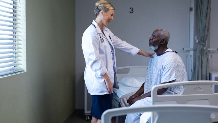 Doctor helping patient