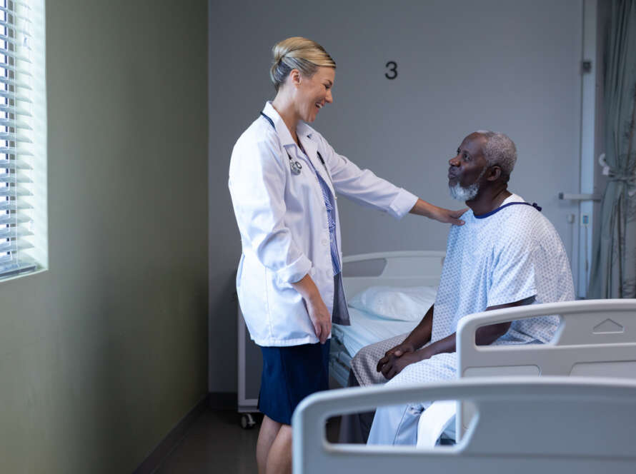 Doctor helping patient